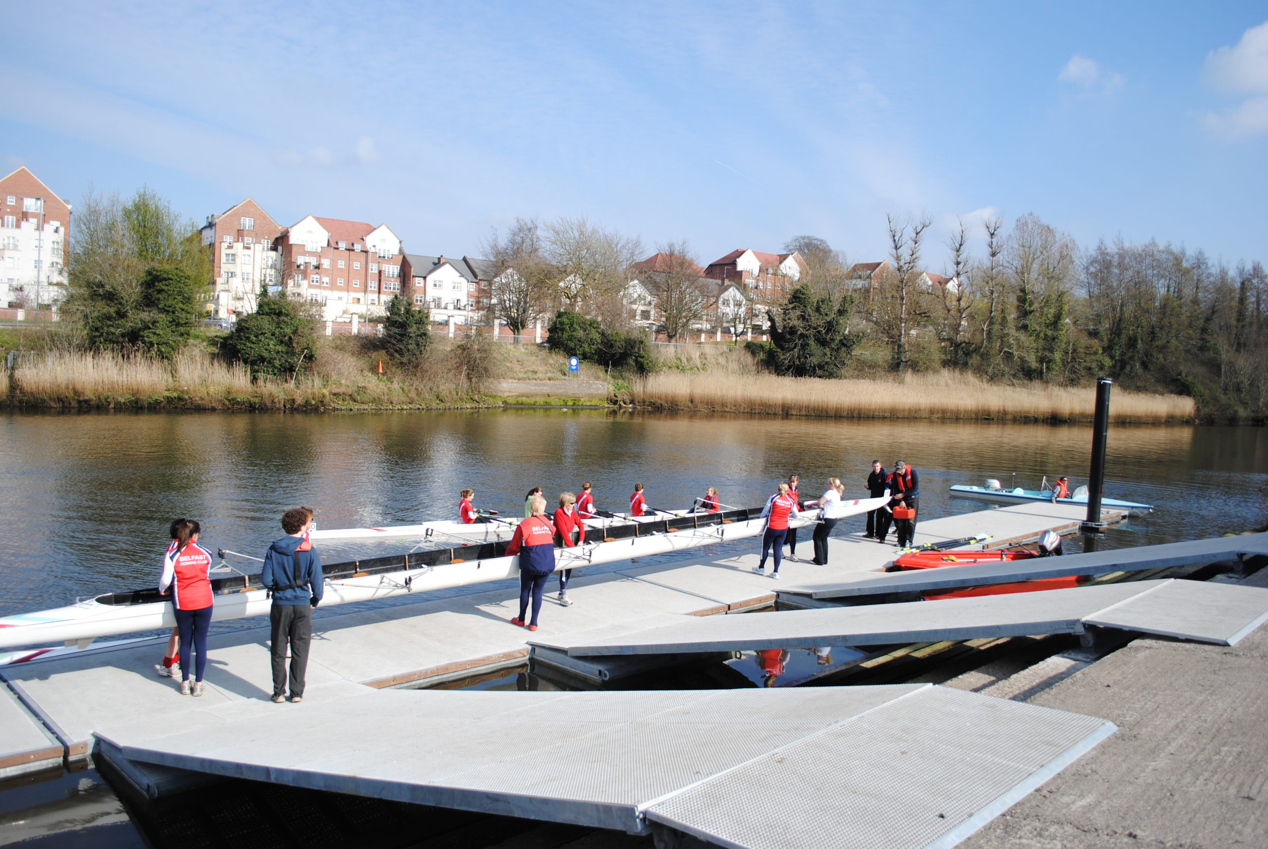Rowers launching boats from specialist rowing pontoon