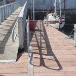 Gangway leading down to a pontoon with service bollard