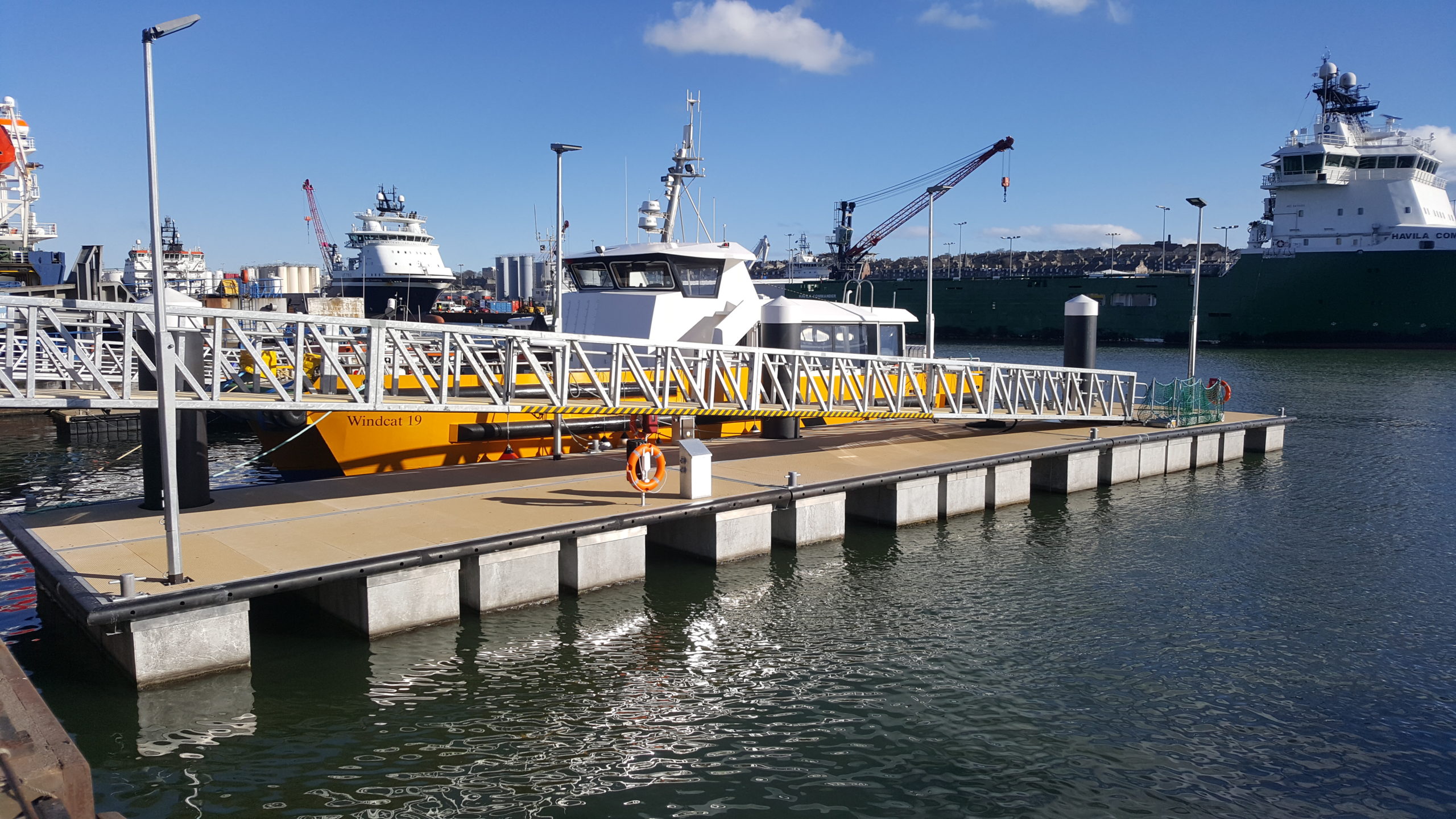 Heavy duty pontoon with gangway and vessel moored alongside