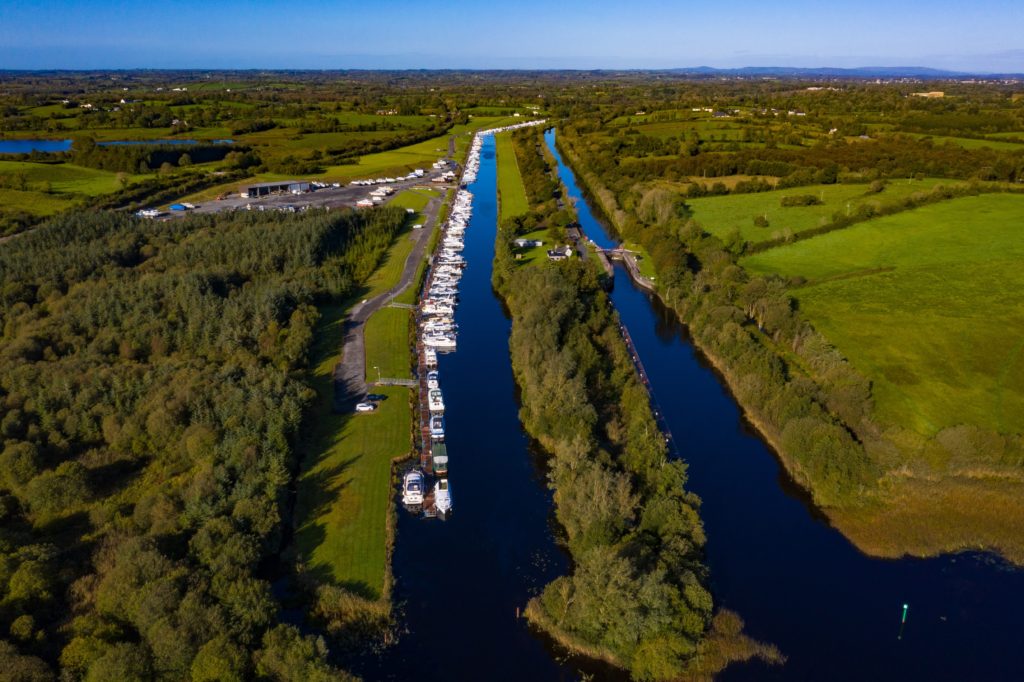 View from the air of long pontoon on left side of canal