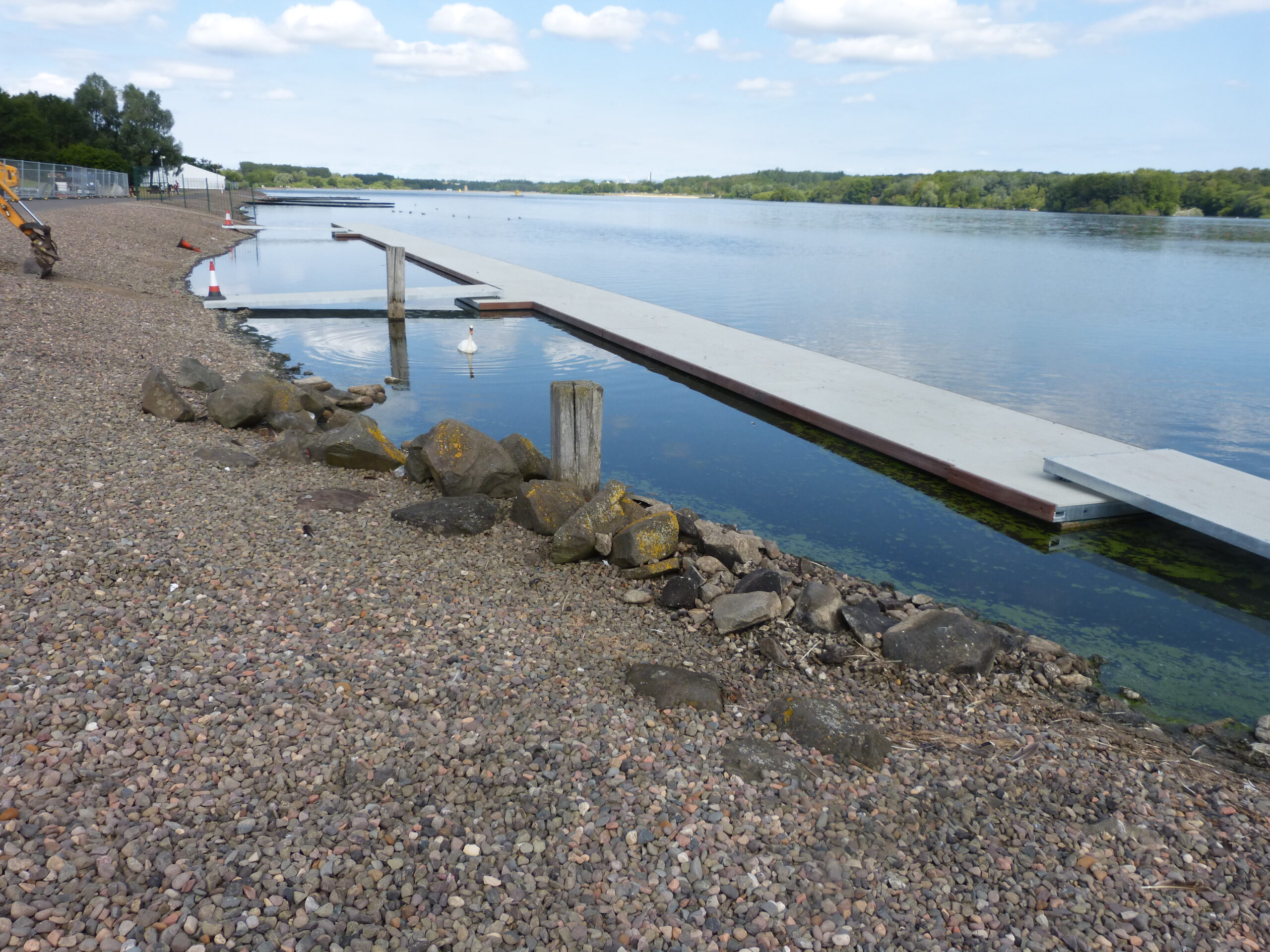 Long T shaped rowing pontoon on the banks of a body of water