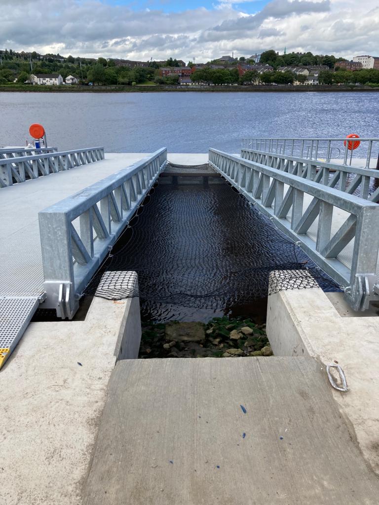 Split-level pontoon leading into river with concrete platform in the foreground
