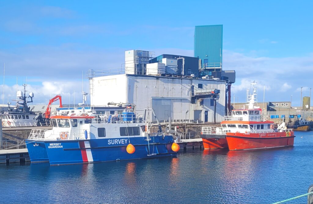 Tugs alongside new pontoon installed by Inland and Coastal at Peterhead Port