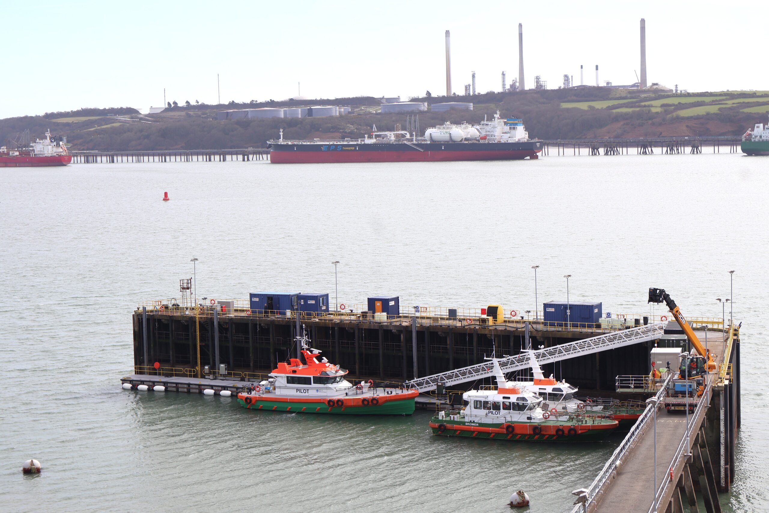 Tugs alongside the new pontoon at the Port of Milford Haven in Pembrokeshire, Wales